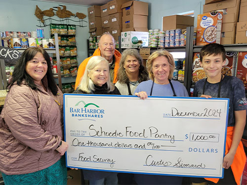 Bar Harbor Bank & Trust employees present a donation to Schoodic Food Pantry.