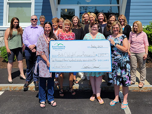 Employees present a donation to Beth C. Wright Cancer Resource Center