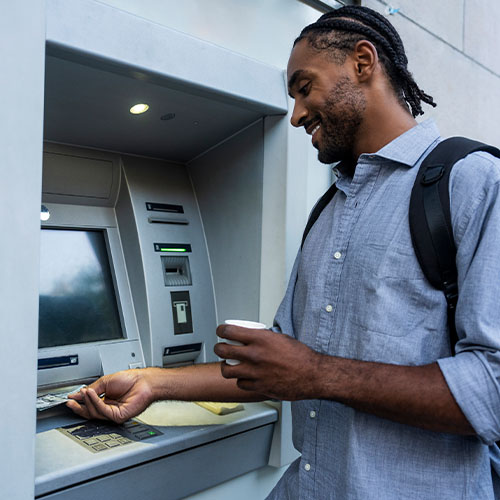 A man getting cash from an ATM