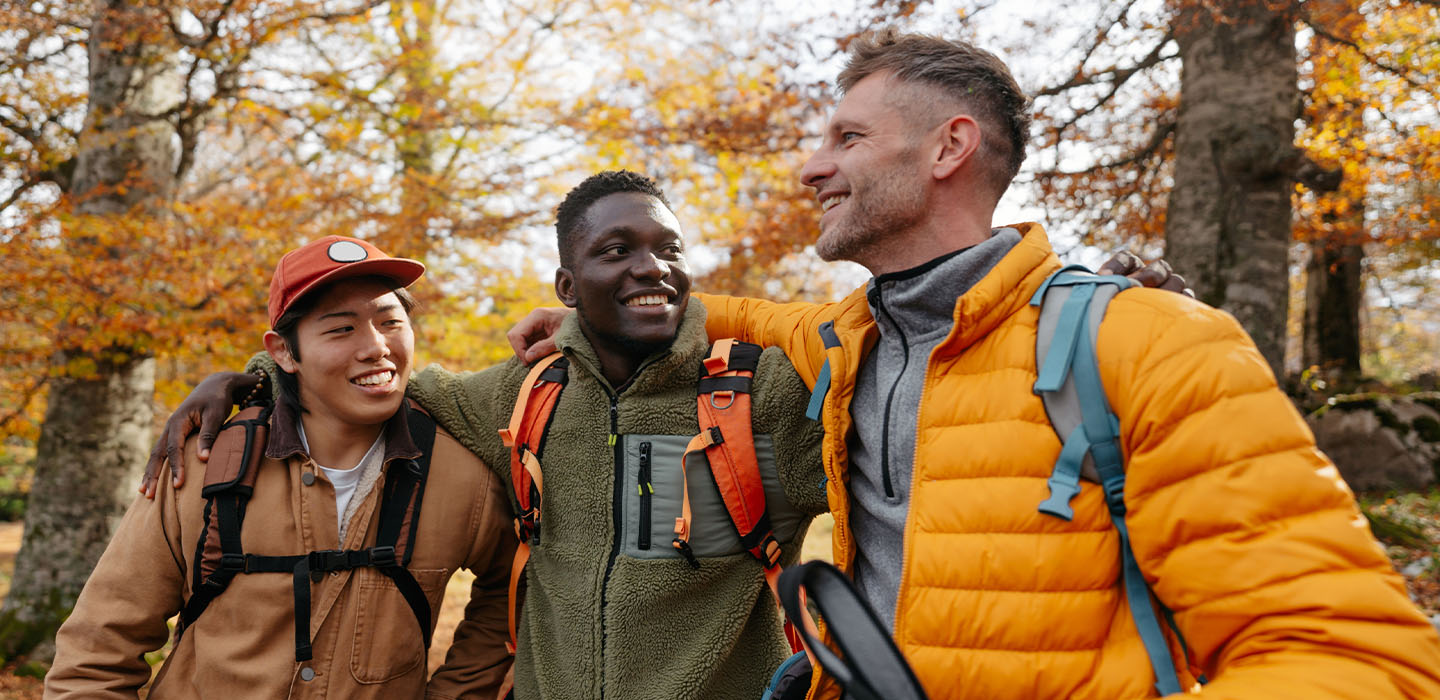 Three men hiking in the woods