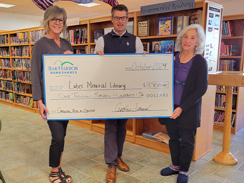 BHBT employees present a donation to Lubec Memorial Library