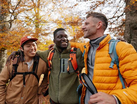 Three men hiking in the woods