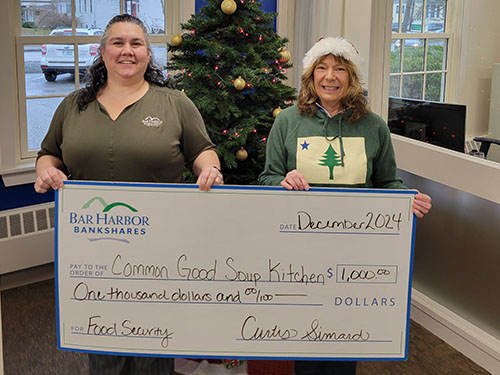 Bar Harbor Bank & Trust employees present a donation to Common Good Soup Kitchen.